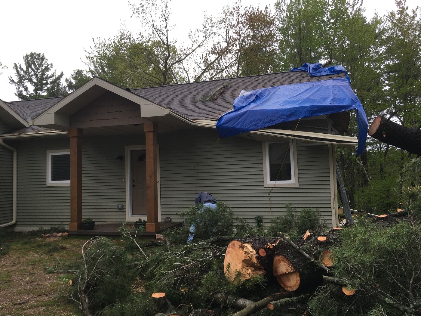 Home with a storm damaged roof