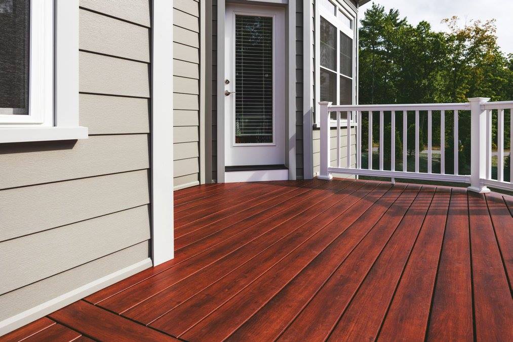 red stained deck on a modern home