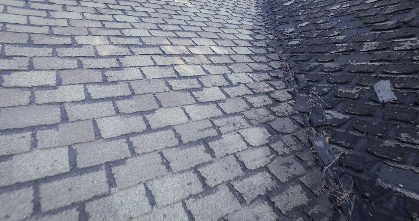 Damaged roofing shingles on a home