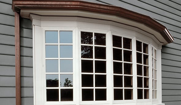bow windows installed on gray Twin Cities home
