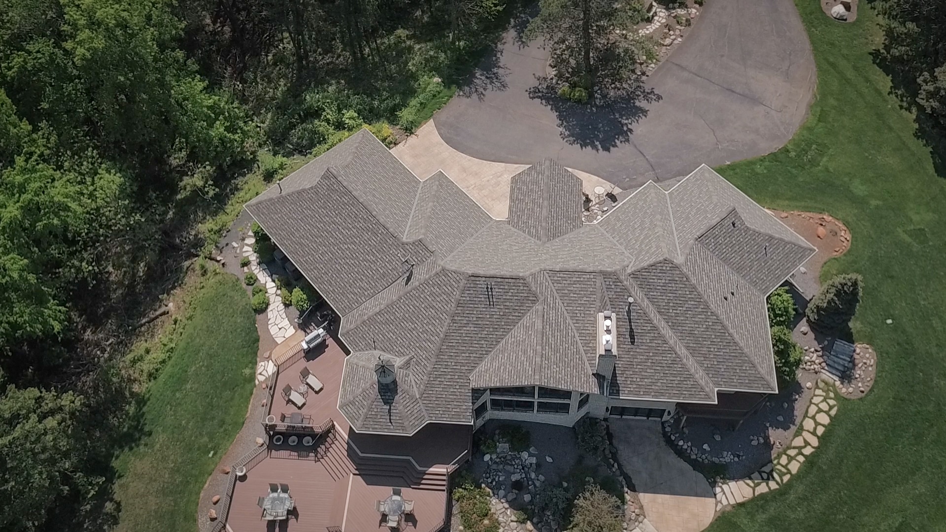 birds eye view of new asphalt roof installed on Afton home 