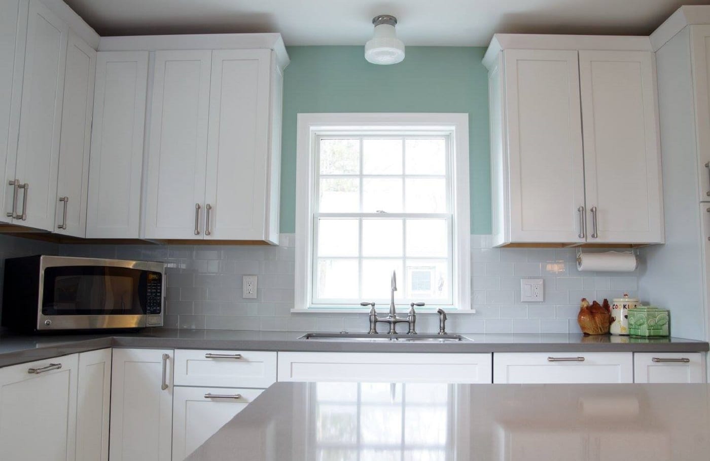 Double hung windows with grilles over a kitchen sink