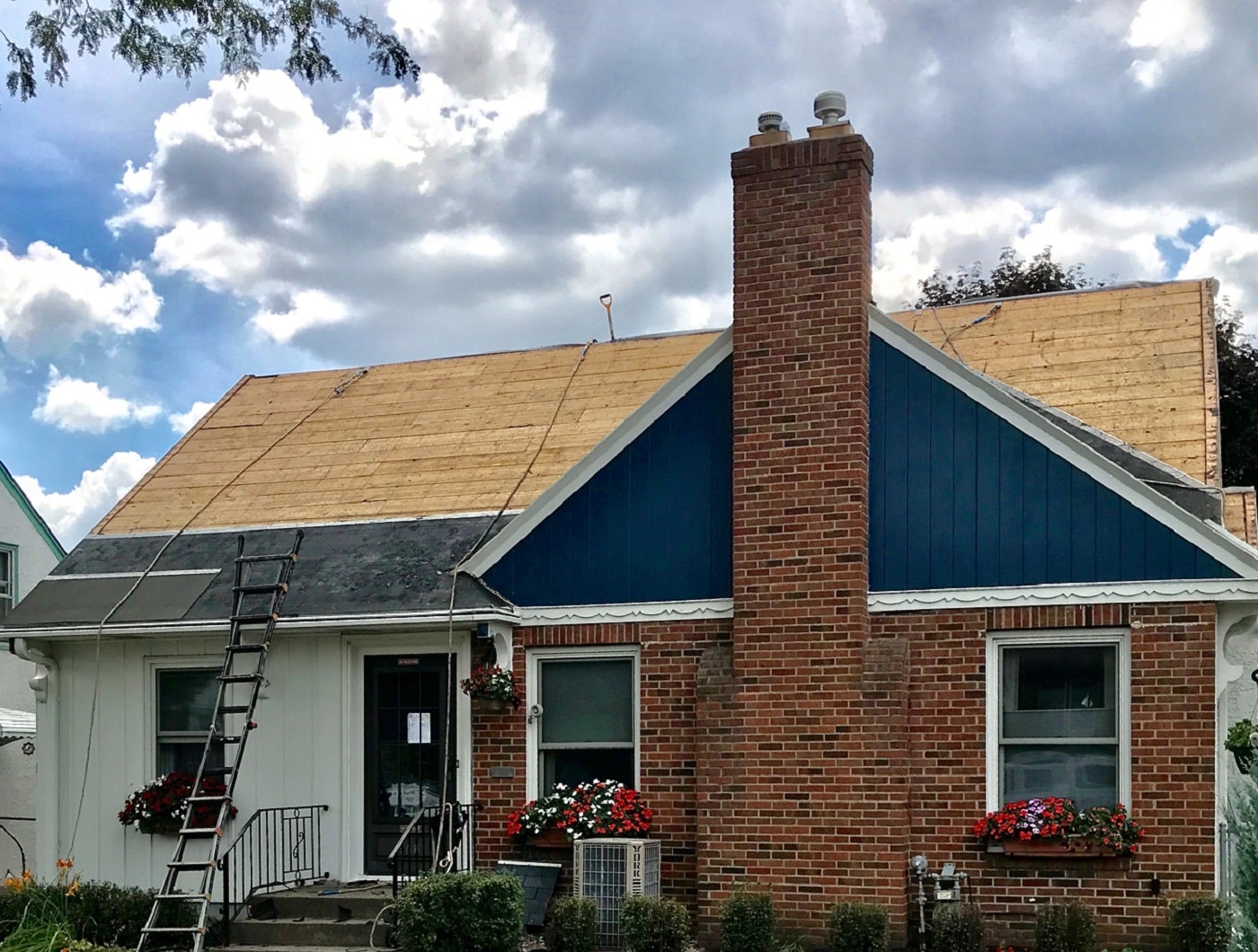 Roof with the decking exposed in the process of having a new roof installed