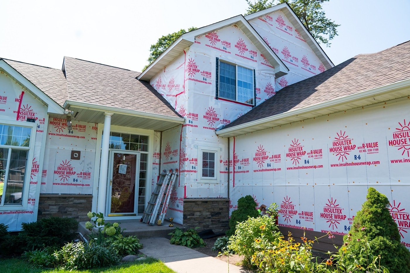 Insultex House Wrap during siding installation