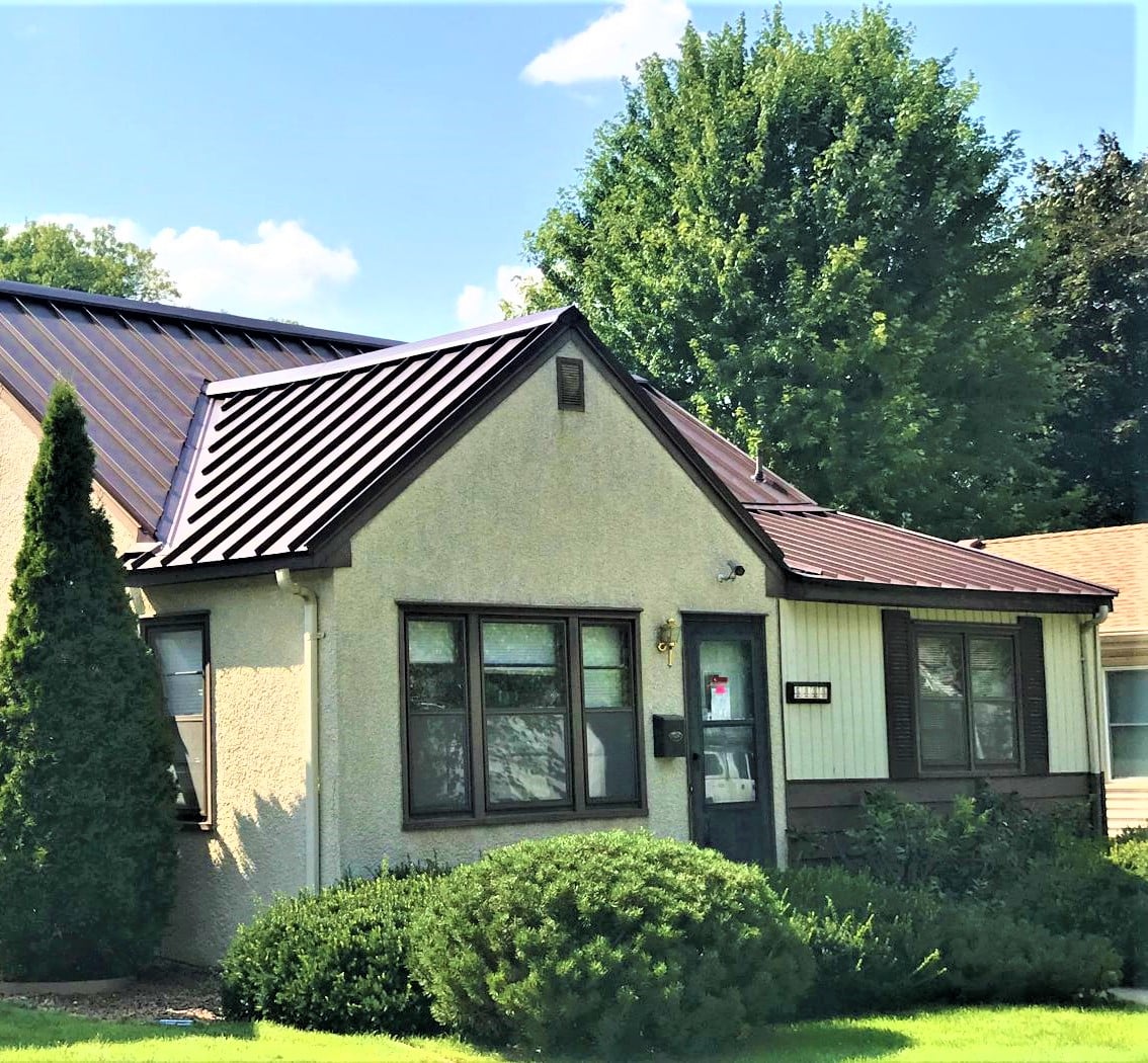 Metal roof on a home with stucco siding
