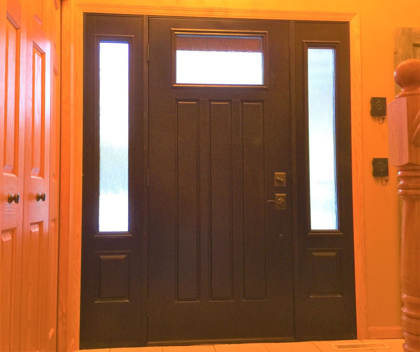 Fiberglass door with sidelights installed on a Twin Cities home by Lindus Construction