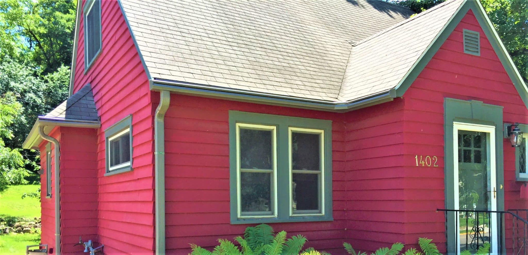 LeafGuard Gutter installation on a red home.