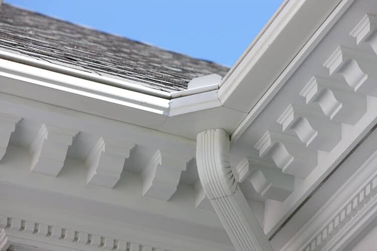 Gutter Installers Coon Rapids MN Picture of LeafGuard® Brand Gutters on a home with white soffit.