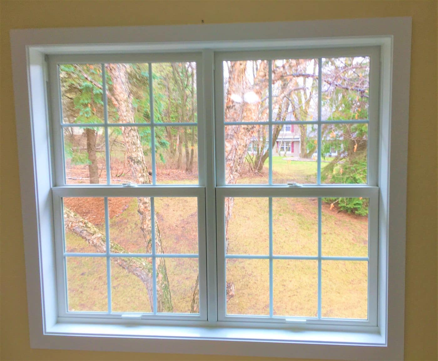 newly installed white double hung windows by Marvin Windows