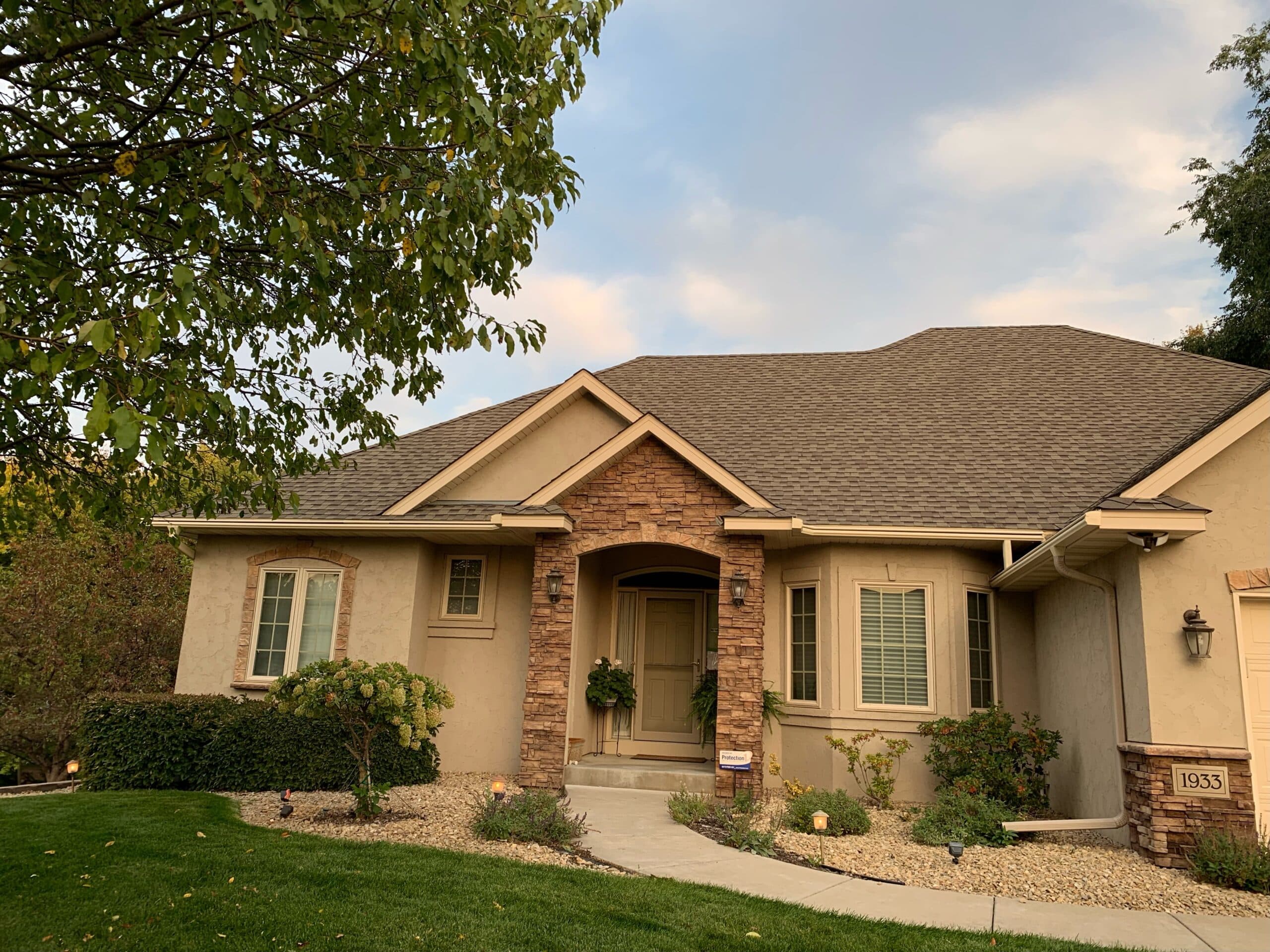 Home with professionally installed roofing, windows, and exterior improvements